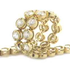 18 Karat Yellow Gold Bezel Set Diamond Tennis Bracelet