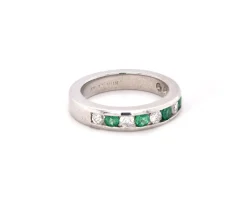 Platinum Channel Set Diamond and Emerald Band